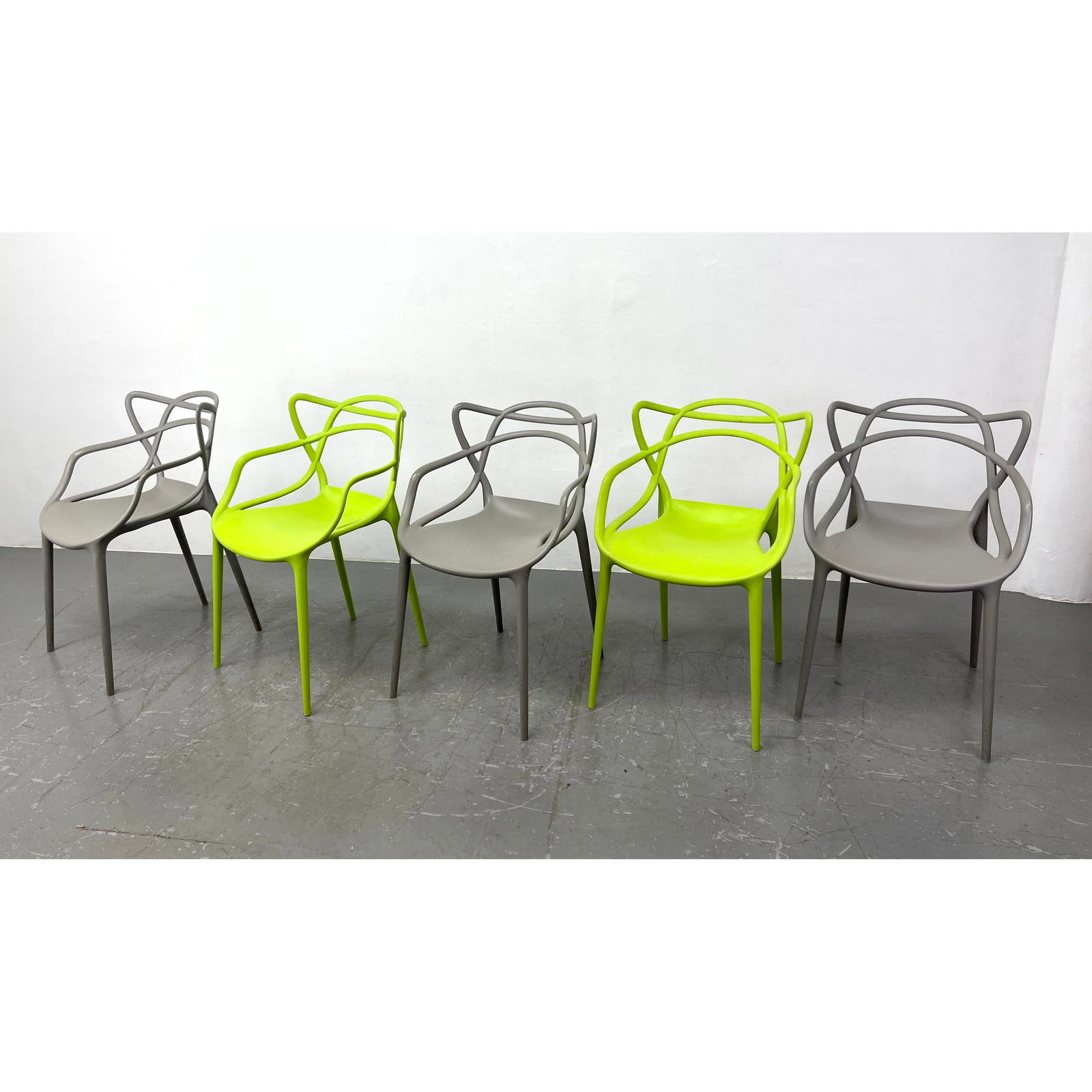 The Masters Chairs for Kartell designed by Phillipe Starck and Eugeni Quitlet. Three Gray and Two Li: The Masters Chairs for Kartell designed by Phillipe Starck and Eugeni Quitlet. Three Gray and Two Lime Green (Lime Chairs Unmarked) Dimensions: Height: 33 inches, Width: 21 inches, Depth: 21 inches. -