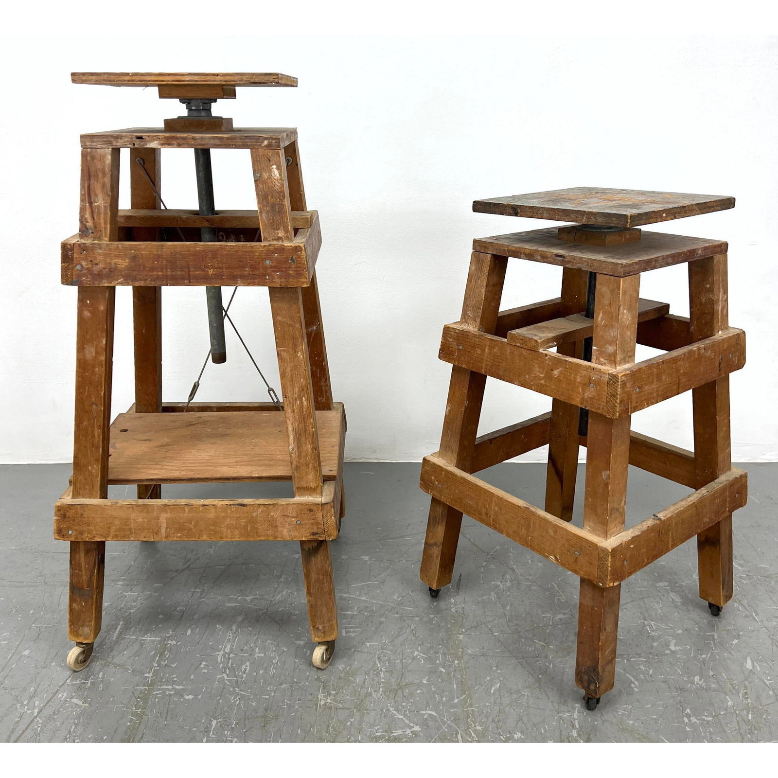 2pc Industrial Artist's Stands. Wood Frames on Casters. Swivel wood square tops.: 2pc Industrial Artist's Stands. Wood Frames on Casters. Swivel wood square tops. Dimensions: Height: 39 inches, Width: 18 inches, Depth: 18 inches. : W: 16.5 inches: D: 16.5 inches ---