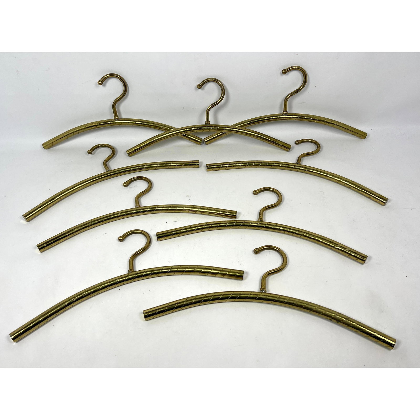 Set 9 Clothes Hangers. Italian Style. Twisted Brass Tone. Hollywood regency Ponti Style: Set 9 Clothes Hangers. Italian Style. Twisted Brass Tone. Hollywood regency Ponti Style Dimensions: Height: 7 inches, Width: 17.5 inches, Depth: 1 inches. --- US Packing and Shipping charge: In house 
