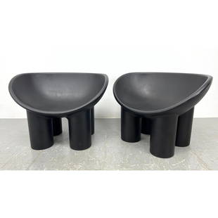 Pr Roly Poly Molded Plastic Lounge Chairs. Black seat with four thick column legs. Faye Toogood Roly: Pr Roly Poly Molded Plastic Lounge Chairs. Black seat with four thick column legs. Faye Toogood Roly Unmarked. Dimensions: Height: 24 inches, Width: 33 inches, Depth: 22 inches. - Seat Height: 14.5 in