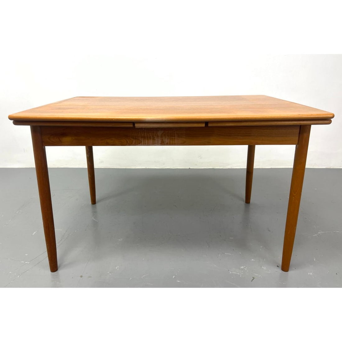 Danish Modern Teak Refractory Dining Table.: Danish Modern Teak Refractory Dining Table. Includes: 2 - inch leaves. Dimensions: Height: 28.5 inches, Width: 48 inches, Depth: 32 inches. --- We offer curbside delivery to NYC, Manhattan, Close Broo