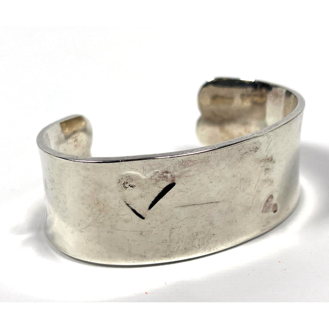 Tiffany and company sterling silver bangle.  Heavy bangle with heart decoration. (1 of 5)