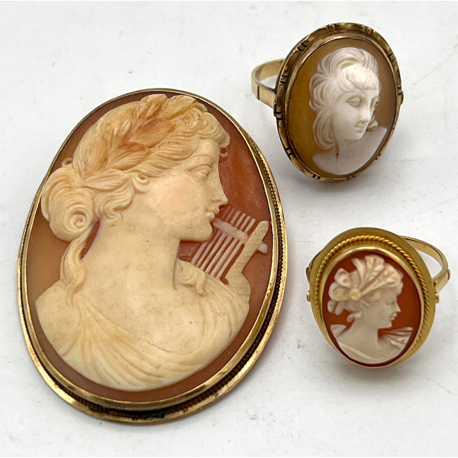 3pc Yellow Gold Carved Shell Cameo Lot. 1) 14k Gold Carved Cameo Pin Pendant; Portrait with harp. 2) (1 of 11)