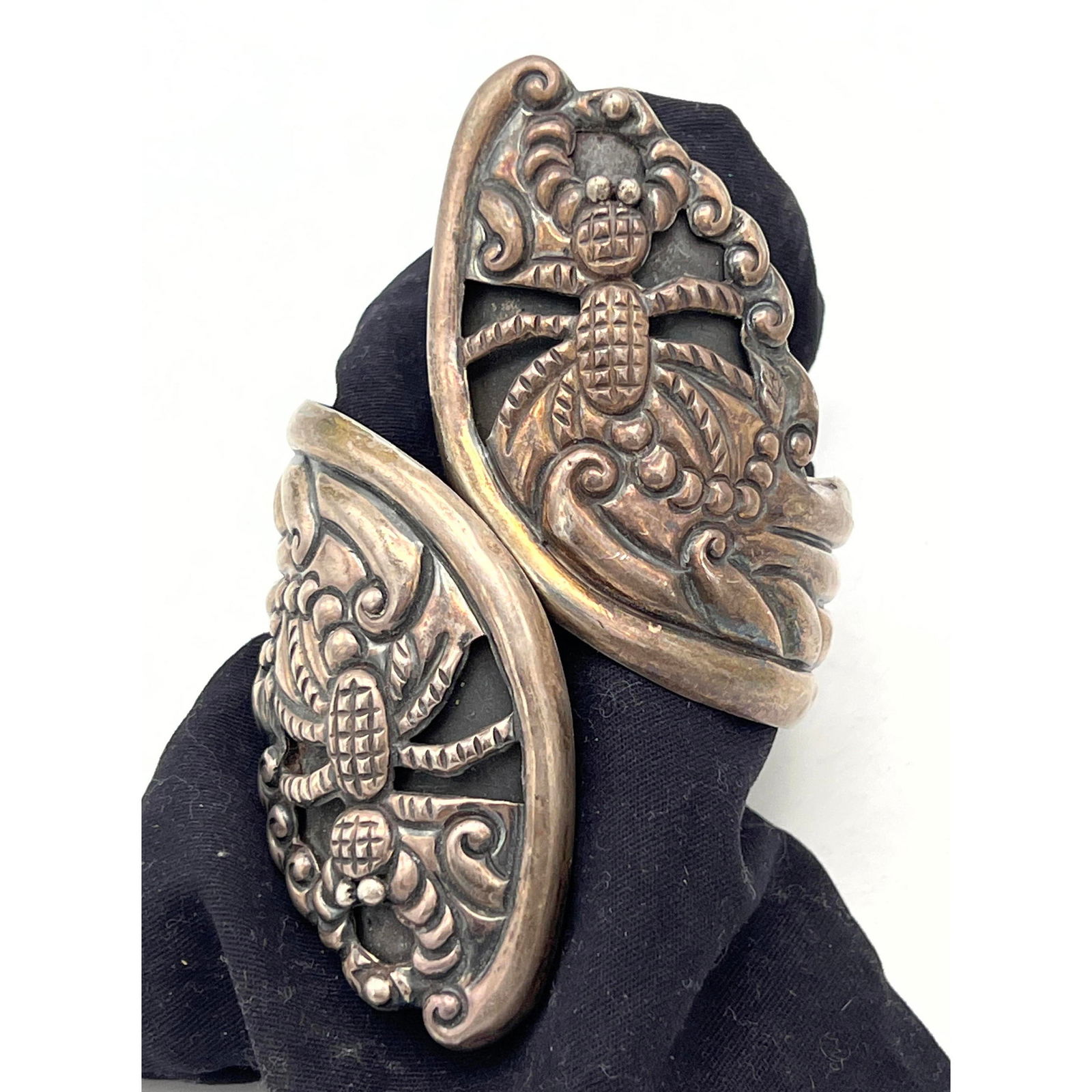 Sterling TAXCO Mexican Hinged Clamper Bracelet. has relief spider design on each large end. Marked. (1 of 6)