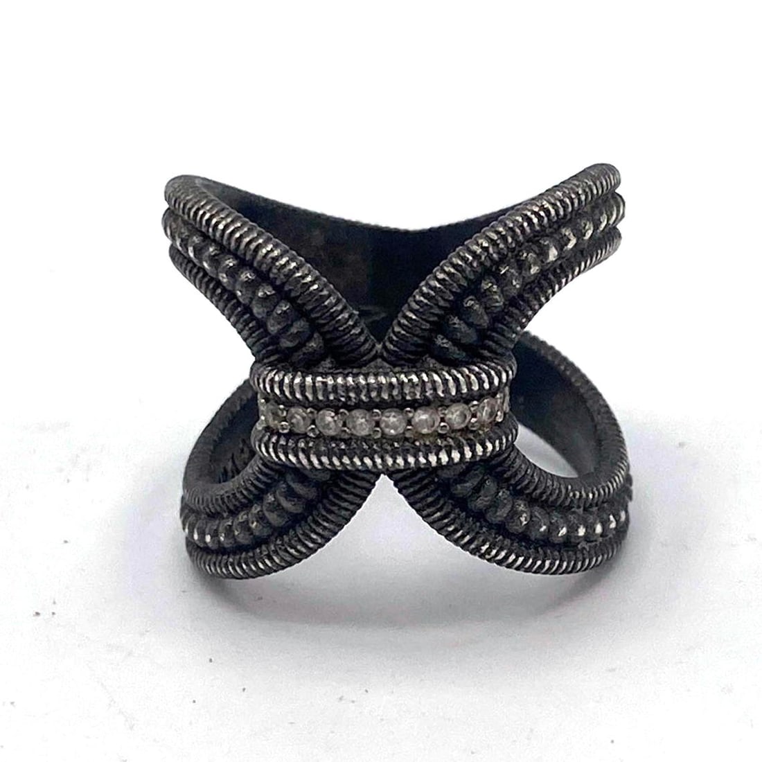 JUDITH RIPKA Sterling Loop Ring. Darker Finish. Row of CZs. Marked. Size 8.: JUDITH RIPKA Sterling Loop Ring. Darker Finish. Row of CZs. Marked. Size 8. --- US Packing and Shipping charge: Jewelry Flat Rate combined Shipping: $10 per item $4 each additional item. $2 per $100 i