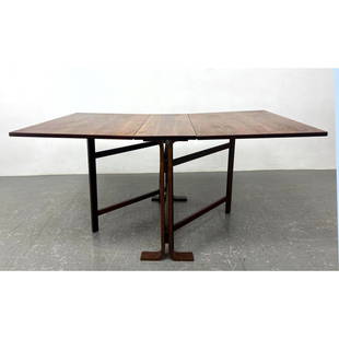 Modernist Rosewood Drop Side Dining Table. Designed by BENDT WINGE for KLEPPE. Extends to 60" long w: Modernist Rosewood Drop Side Dining Table. Designed by BENDT WINGE for KLEPPE. Extends to 60" long when both leaves are up. Marked Norway. Includes: 2 - 23.5 inch leaves. Dimensions: Height: 28.75 inc