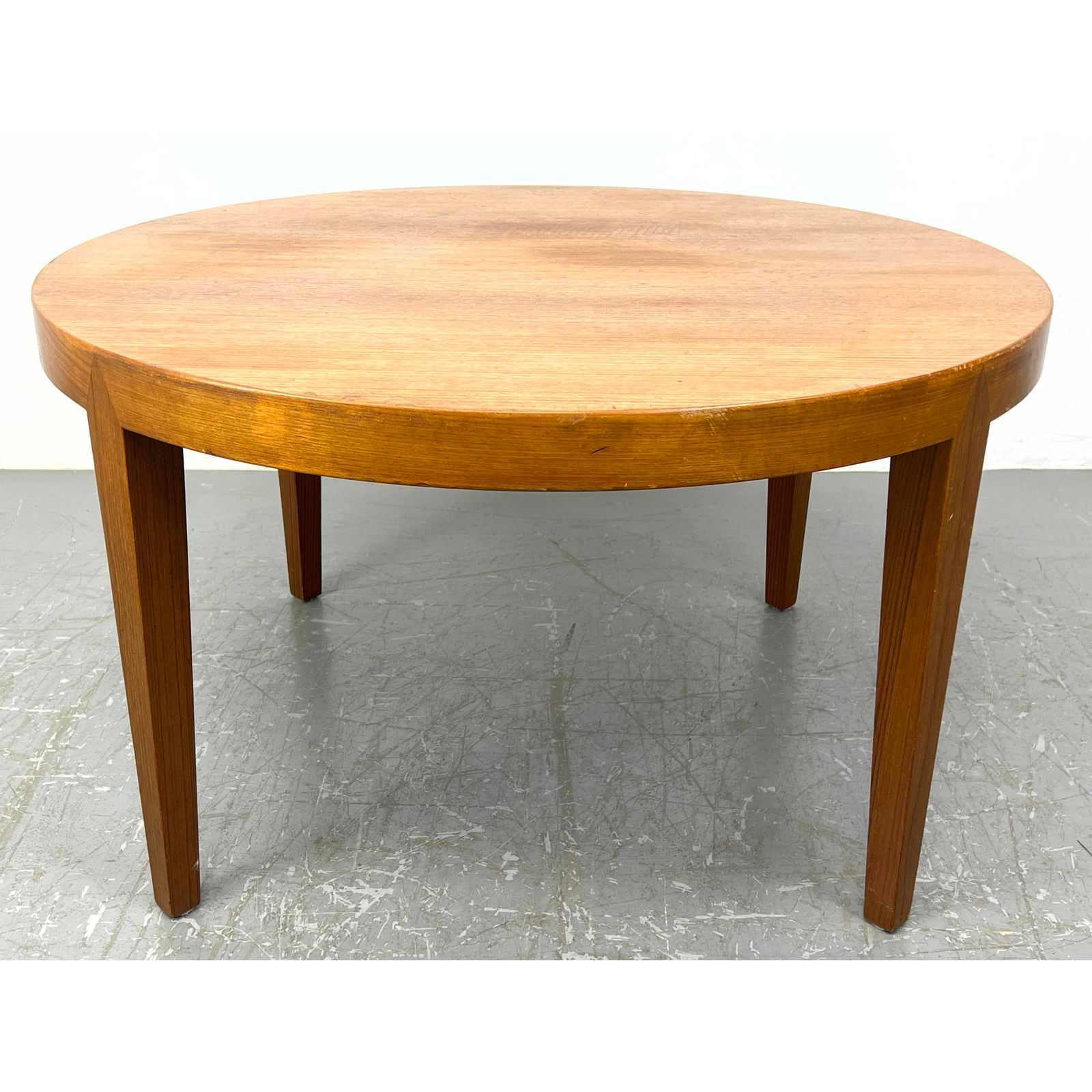 Severin Hansen for Haslev Teak Round Coffee Table. Remnant of Haslev Deer Label on Base. Staining to: Severin Hansen for Haslev Teak Round Coffee Table. Remnant of Haslev Deer Label on Base. Staining to top. Dimensions: Height: 20 inches, Width: 35.5 inches, Depth: 35.5 inches. ---