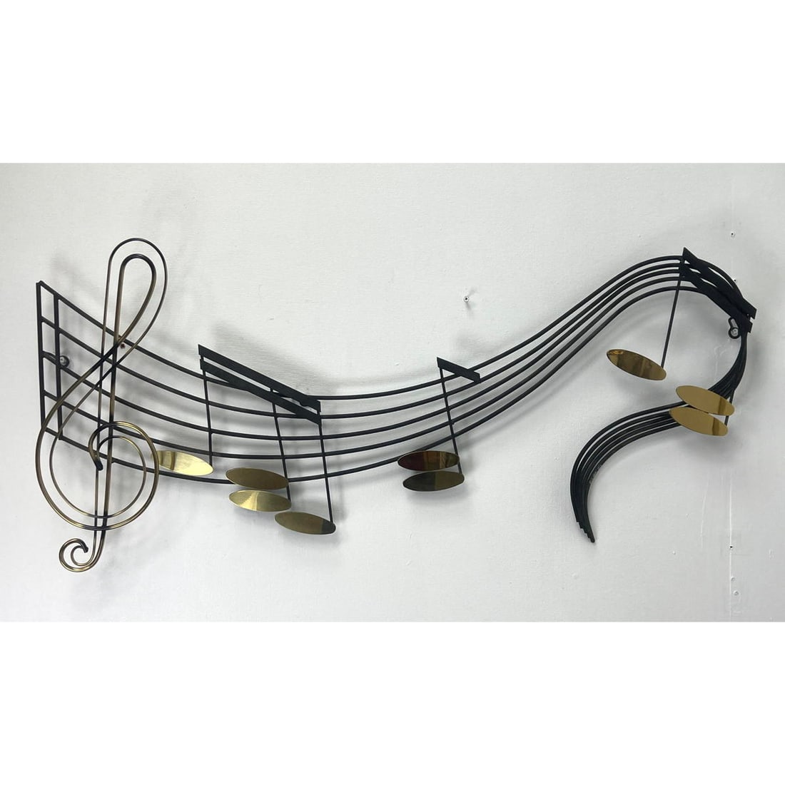 Signed and Dated C JERE Painted Steal and Brass Music Notes Wall Sculpture: Signed and Dated C JERE Painted Steal and Brass Music Notes Wall Sculpture Dimensions: Height: 18.5 inches, Width: 41 inches, Depth: 3 inches. ---