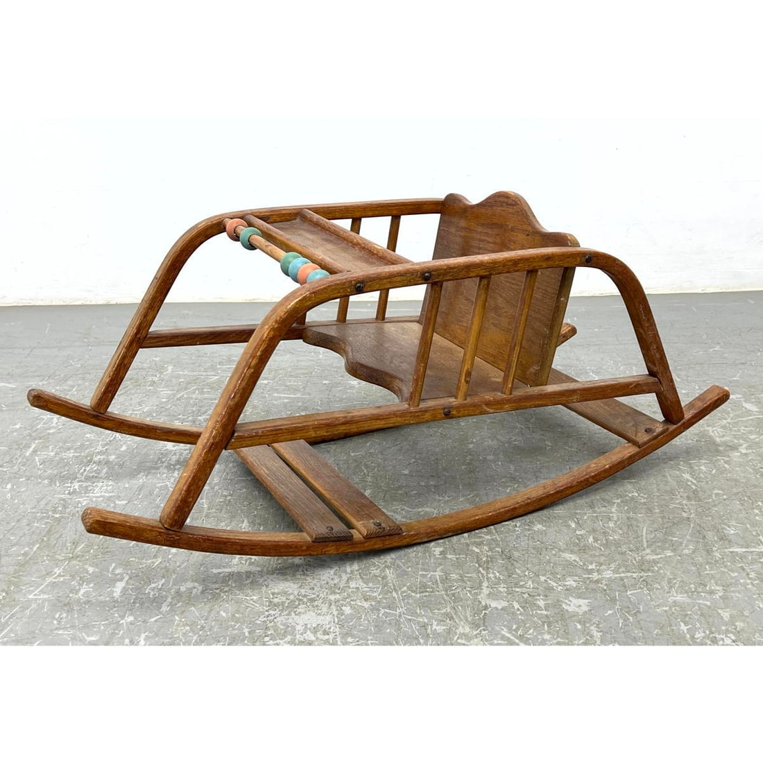 Vintage Bentwood Toddler Rocking Chair, Rocker. Colored Wood bead Play Area. DELPHOS Bending Co labe: Vintage Bentwood Toddler Rocking Chair, Rocker. Colored Wood bead Play Area. DELPHOS Bending Co label. Dimensions: Height: 13.75 inches, Width: 14 inches, Depth: 33.5 inches. ---