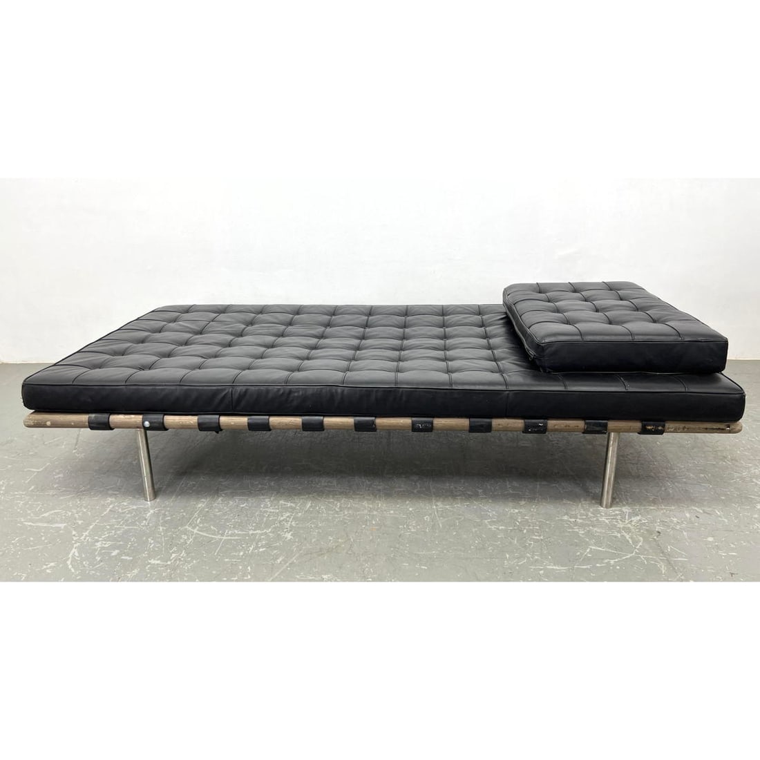 Leather Barcelona Daybed in style of Van der Rohe. Tufted black upholstery. Flat pillow: Leather Barcelona Daybed in style of Van der Rohe. Tufted black upholstery. Flat pillow instead of bolster. Dimensions: Height: 16 inches, Width: 79 inches, Depth: 37 inches. ---