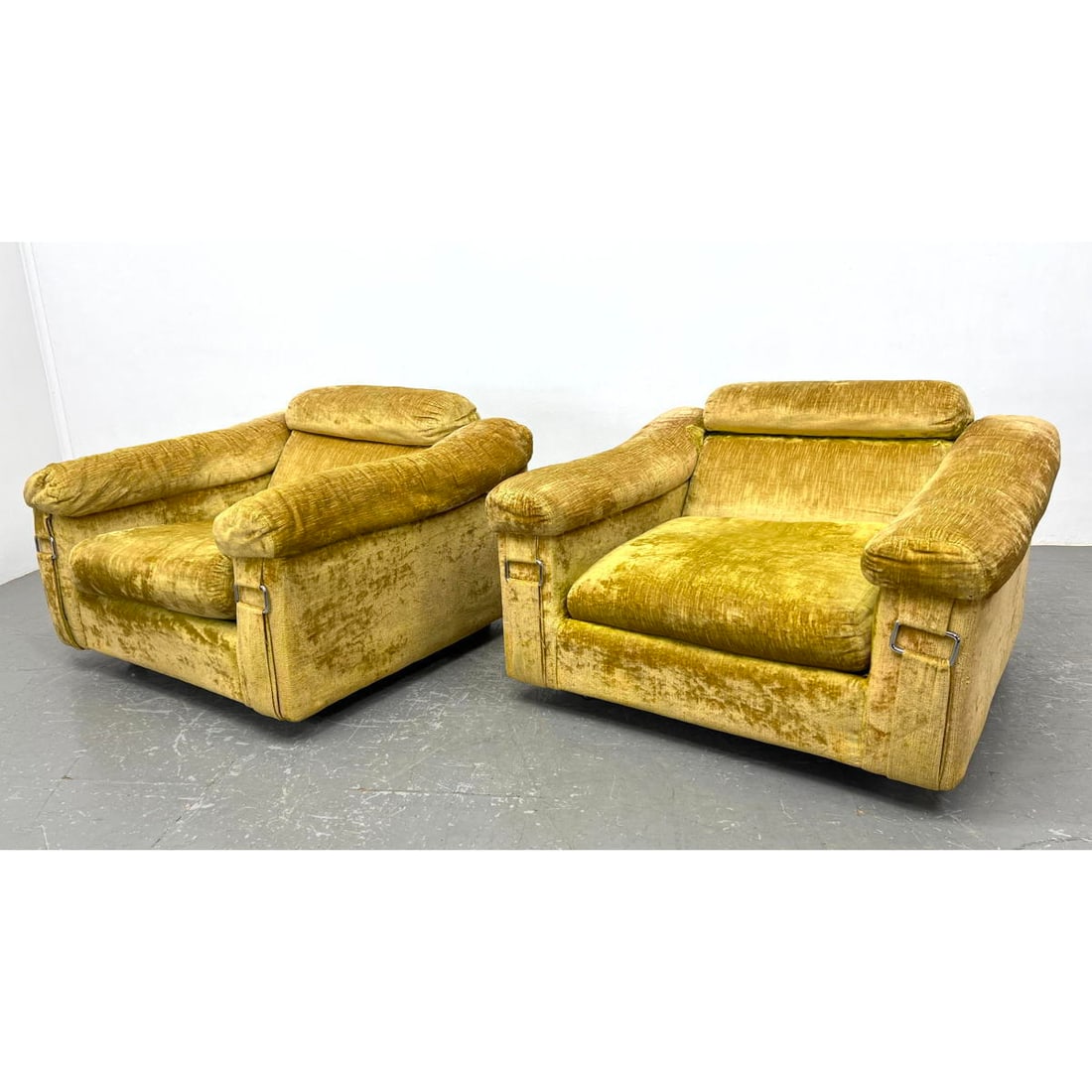 Pr SELIG Imperial Upholstered Club Lounge Chairs. Gold chenille fabric. Strap and buckle details to: Pr SELIG Imperial Upholstered Club Lounge Chairs. Gold chenille fabric. Strap and buckle details to front of arms. Label. Dimensions: Height: 26 inches, Width: 40 inches, Depth: 37 inches. - Seat Heig