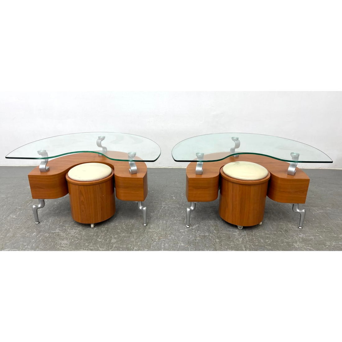 2 Semi Circle Curved Wood, Glass Coffee Tables. Each has matching vinyl cushion round stool that rol: 2 Semi Circle Curved Wood, Glass Coffee Tables. Each has matching vinyl cushion round stool that rolls on casters and fits inside curve. Dimensions: Height: 19 inches, Width: 35.5 inches, Depth: 22.5 