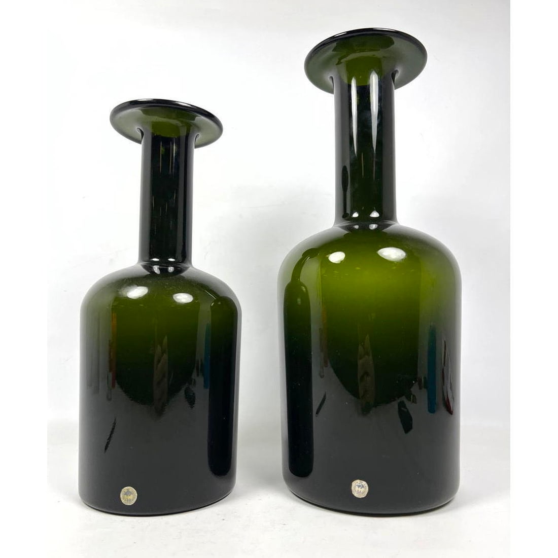 2pcs Otto Brauer Holmegaard Danish Modern Bottle Vases. Green Glass.: 2pcs Otto Brauer Holmegaard Danish Modern Bottle Vases. Green Glass. Dimensions: Height: 17 inches, Width: 7 inches, Depth: 7 inches. - Additional Dimensions: Smaller H: 14.25 inches, W: 6 inches, D: