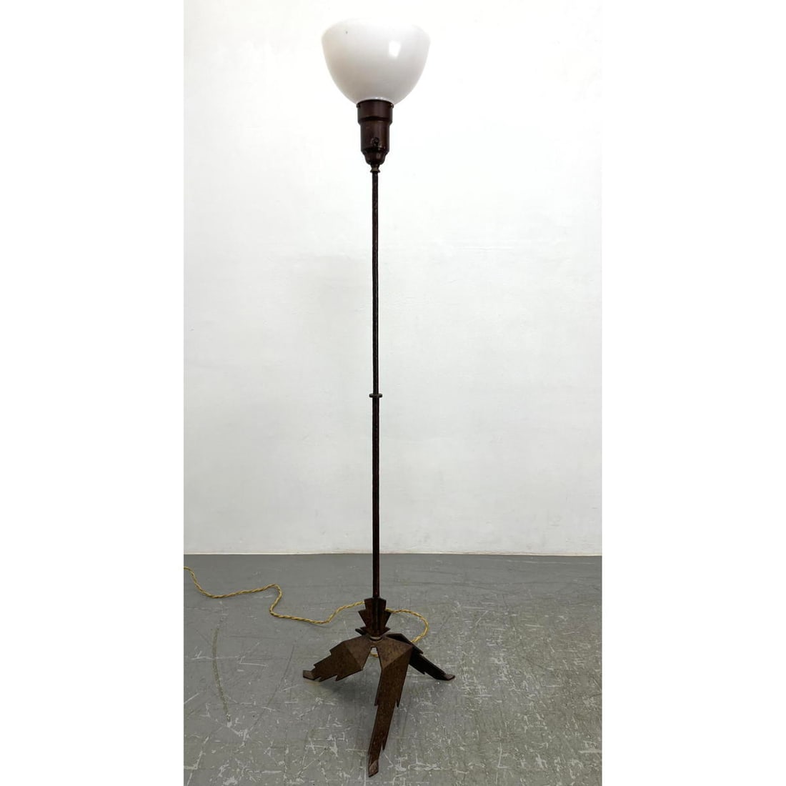 Hammered Iron Floor Lamp. Aubrey Beardsley Style angled base.: Hammered Iron Floor Lamp. Aubrey Beardsley Style angled base. Dimensions: Height: 61.5 inches, Width: 16.25 inches, Depth: 16.25 inches. ---