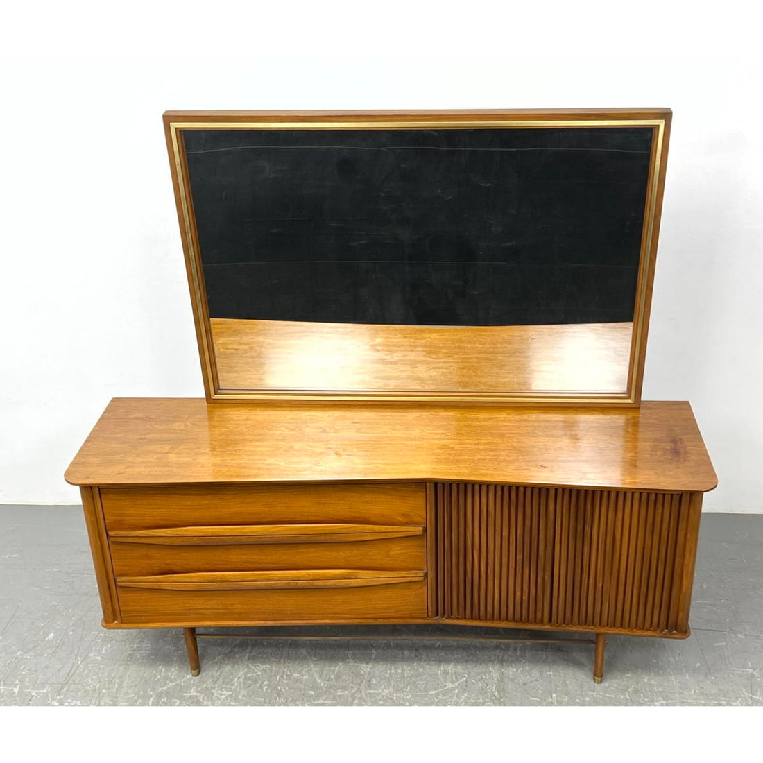American Modern Angled front Low Dresser Chest and Mirror.: American Modern Angled front Low Dresser Chest and Mirror. Dimensions: Height: 32 inches, Width: 76 inches, Depth: 21 inches. - Additional Dimensions: Mirror H: 39 inches, W: 57 inches ---