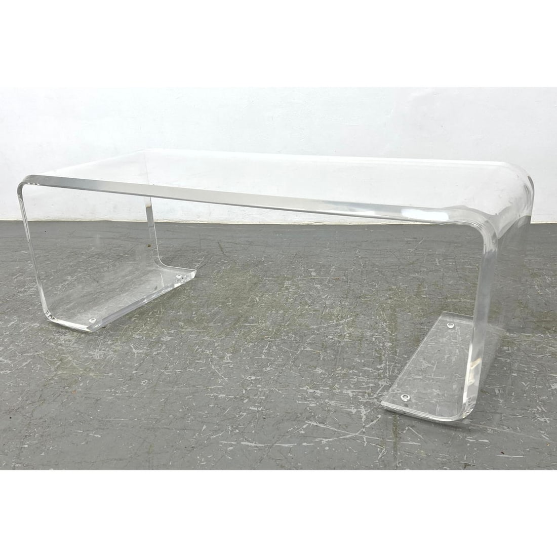 Modernist Clear Lucite Rolled Coffee Table. Clear Acrylic.: Modernist Clear Lucite Rolled Coffee Table. Clear Acrylic. Dimensions: Height: 18 inches, Width: 50 inches, Depth: 20 inches. ---