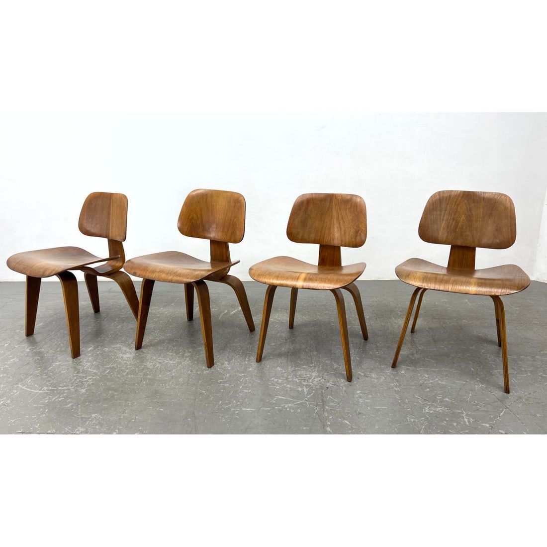 Set 4 DCW Chairs by Charles Eames. Manufactured by Evans products company for Herman Miller. (1 of 12)