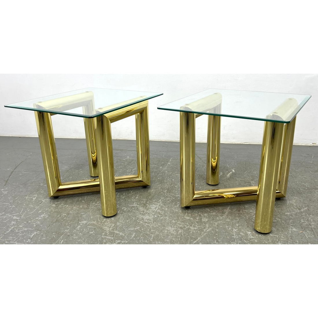 Pair Brass plated thick tubular end tables. Bevel glass tops. Karl Springer style. Adjustable feet (1 of 13)