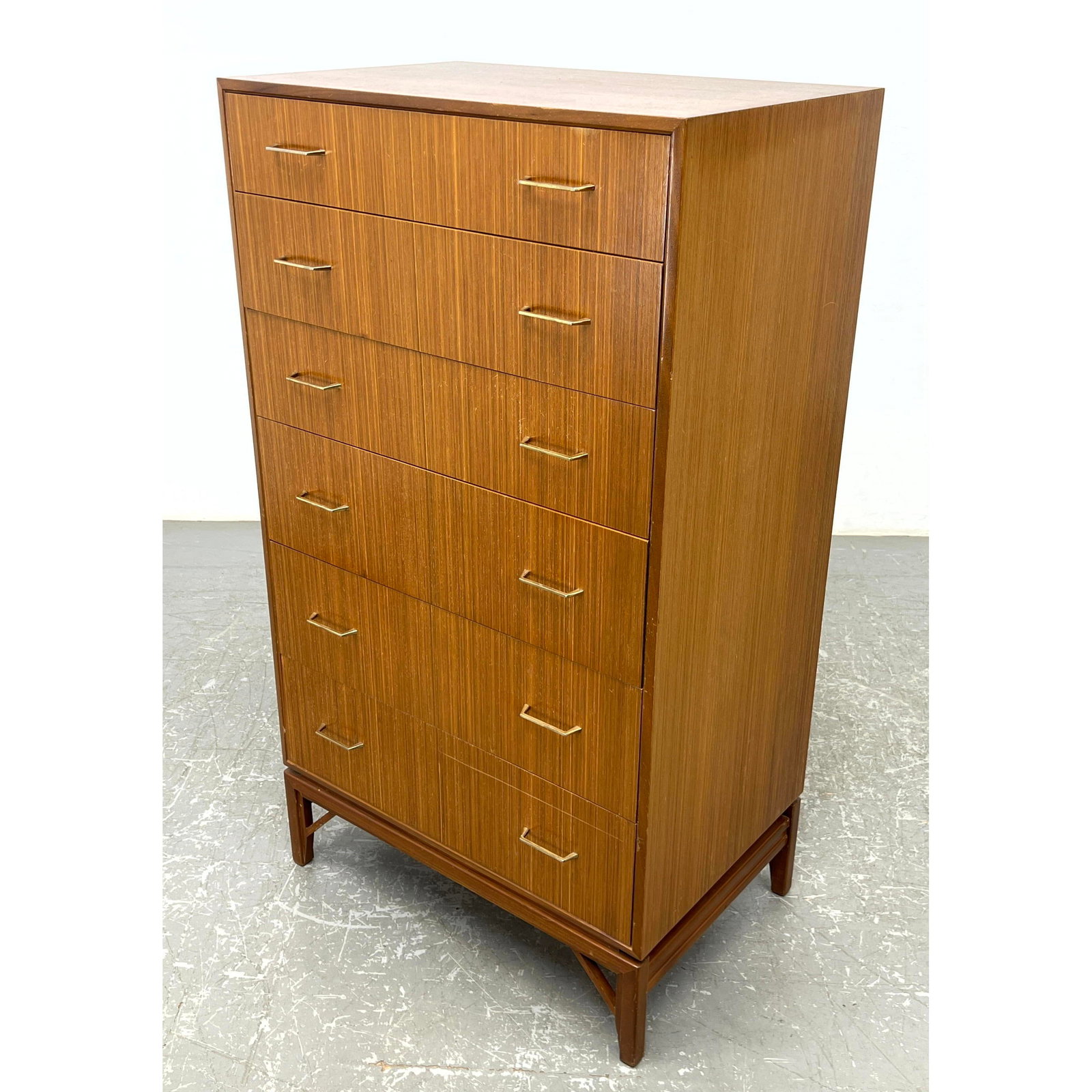 Danish Modern Tall Chest of Drawers. Dresser. Raised on leg frame. Metal pulls.: Danish Modern Tall Chest of Drawers. Dresser. Raised on leg frame. Metal pulls. Dimensions: Height: 48 inches, Width: 27 inches, Depth: 18 inches. --- - - We offer curbside delivery to NYC, Manhattan,
