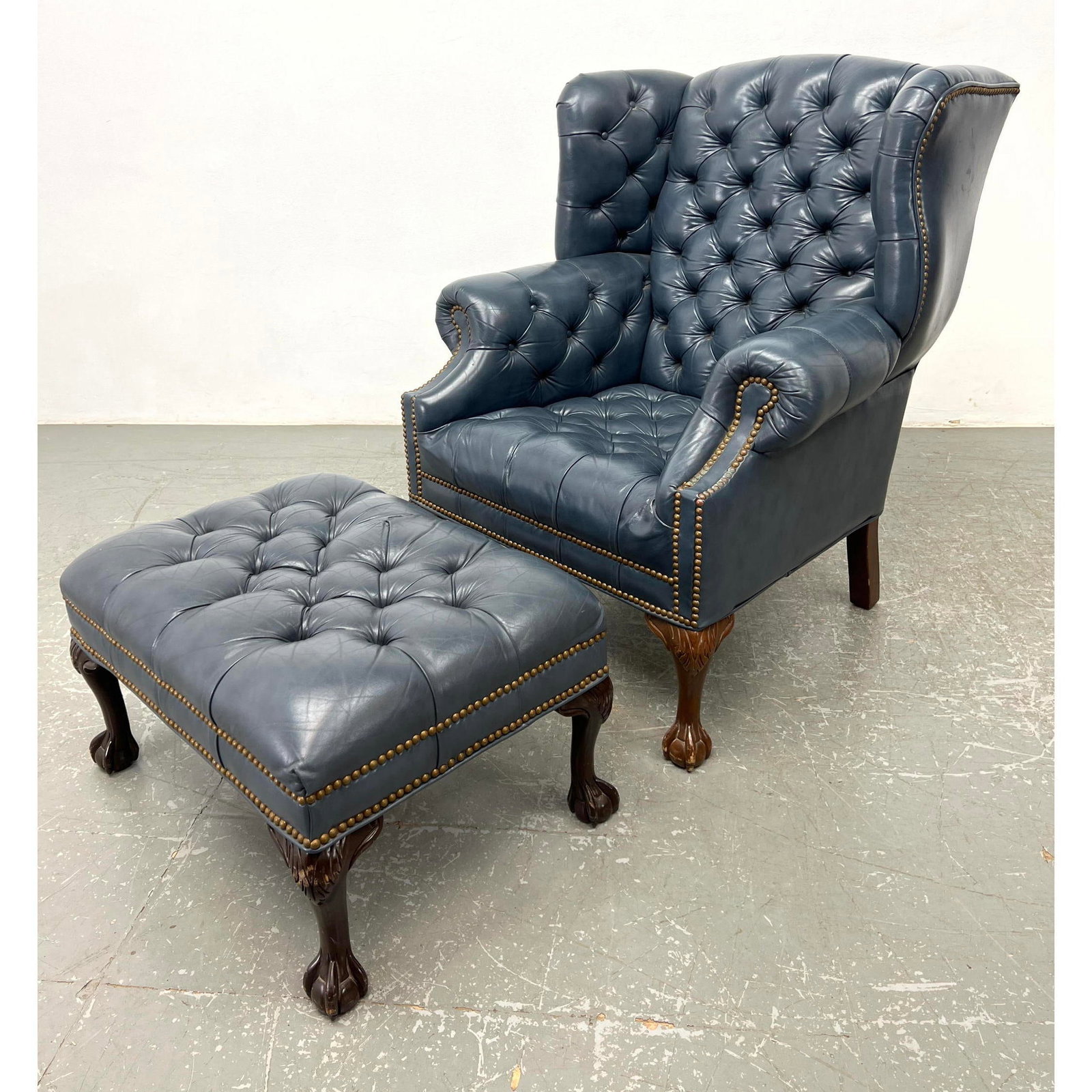 2pc Leather Wing Chair and Foot Stool. Blue Tufted Leather with brass stud trim. Ball and Claw Feet. (1 of 20)