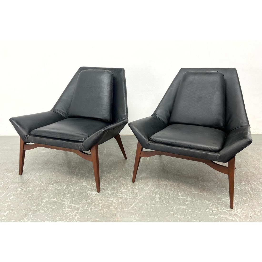Pr Black Vinyl Modernist Lounge Chairs. Angle Flared Arms. Tapered Backs. Wood Legs and Frame. (1 of 12)
