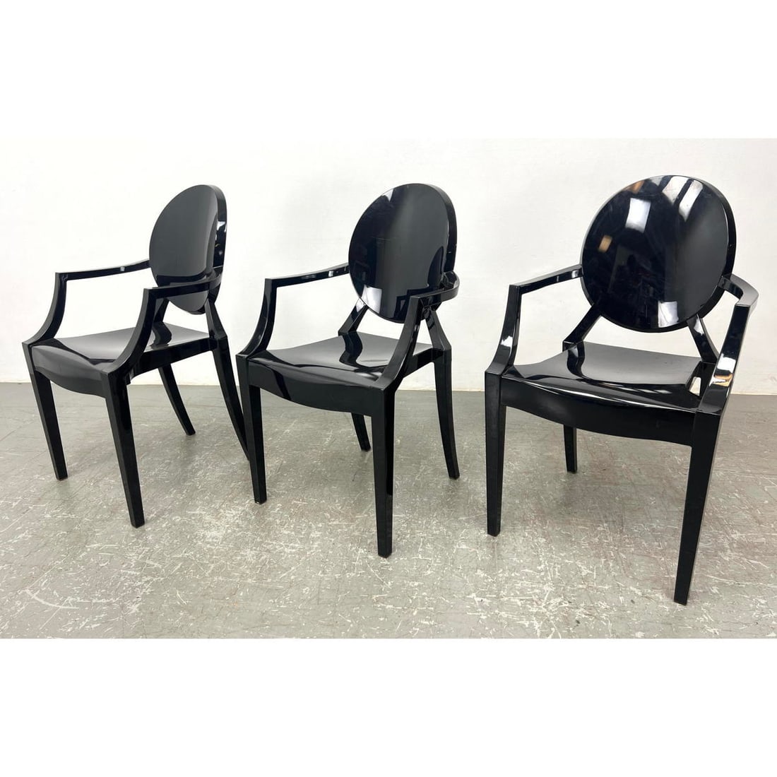 Set 3 Black Acrylic Arm Chairs. Philippe Starck Style.: Set 3 Black Acrylic Arm Chairs. Philippe Starck Style. Dimensions: Height: 36.5 inches, Width: 21.25 inches, Depth: 21 inches. - Seat Height: 19 inches --- - - We offer curbside delivery to NYC, Manha