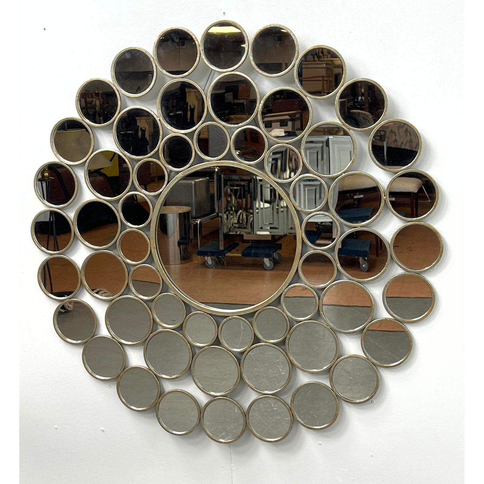 Contemporary Round mirror made of metal framed connected circles. (1 of 6)