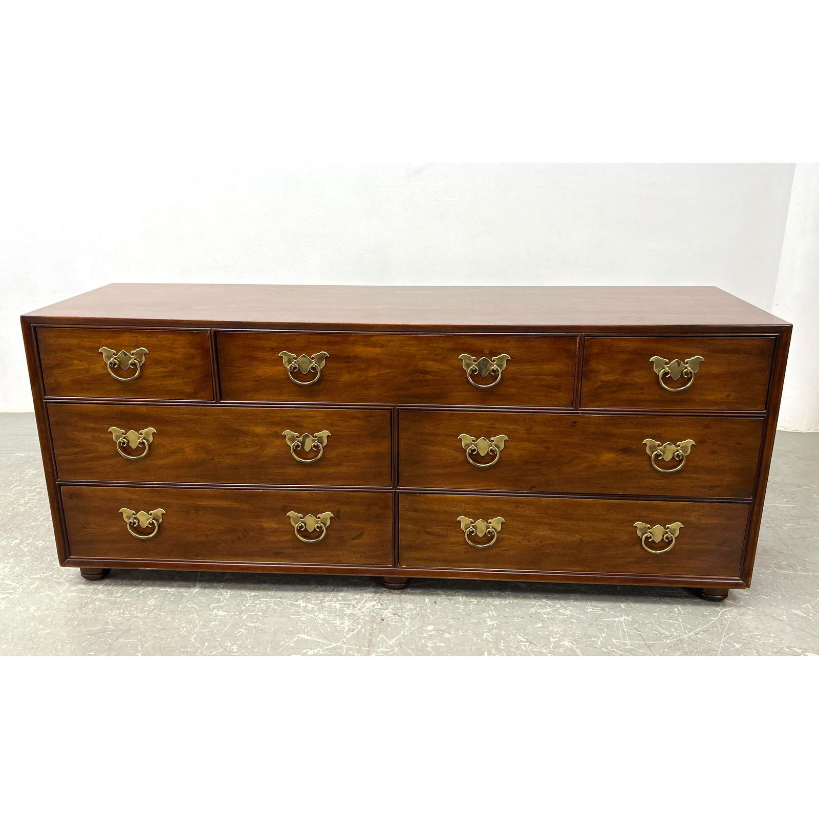 HENREDON Traditional Dresser Chest of Drawers. Brass Bat Wing Hardware with ring pulls. Marked: HENREDON Traditional Dresser Chest of Drawers. Brass Bat Wing Hardware with ring pulls. Marked Dimensions: Height: 29.75 inches, Width: 72 inches, Depth: 19 inches. --- - - We offer curbside delivery