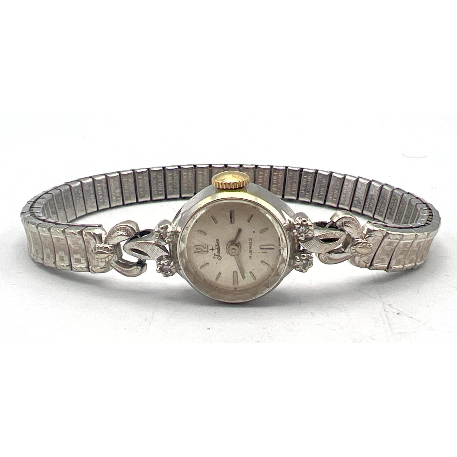 14K Gold TRADITION 17 Jewel Ladies Watch. Small round face with diamond accents to frame. SPEIDEL St: 14K Gold TRADITION 17 Jewel Ladies Watch. Small round face with diamond accents to frame. SPEIDEL Stretch band. Case Marked 14K Gold. Weight: 11.4 DWT --- US Packing and Shipping charge: $20 Plus insu
