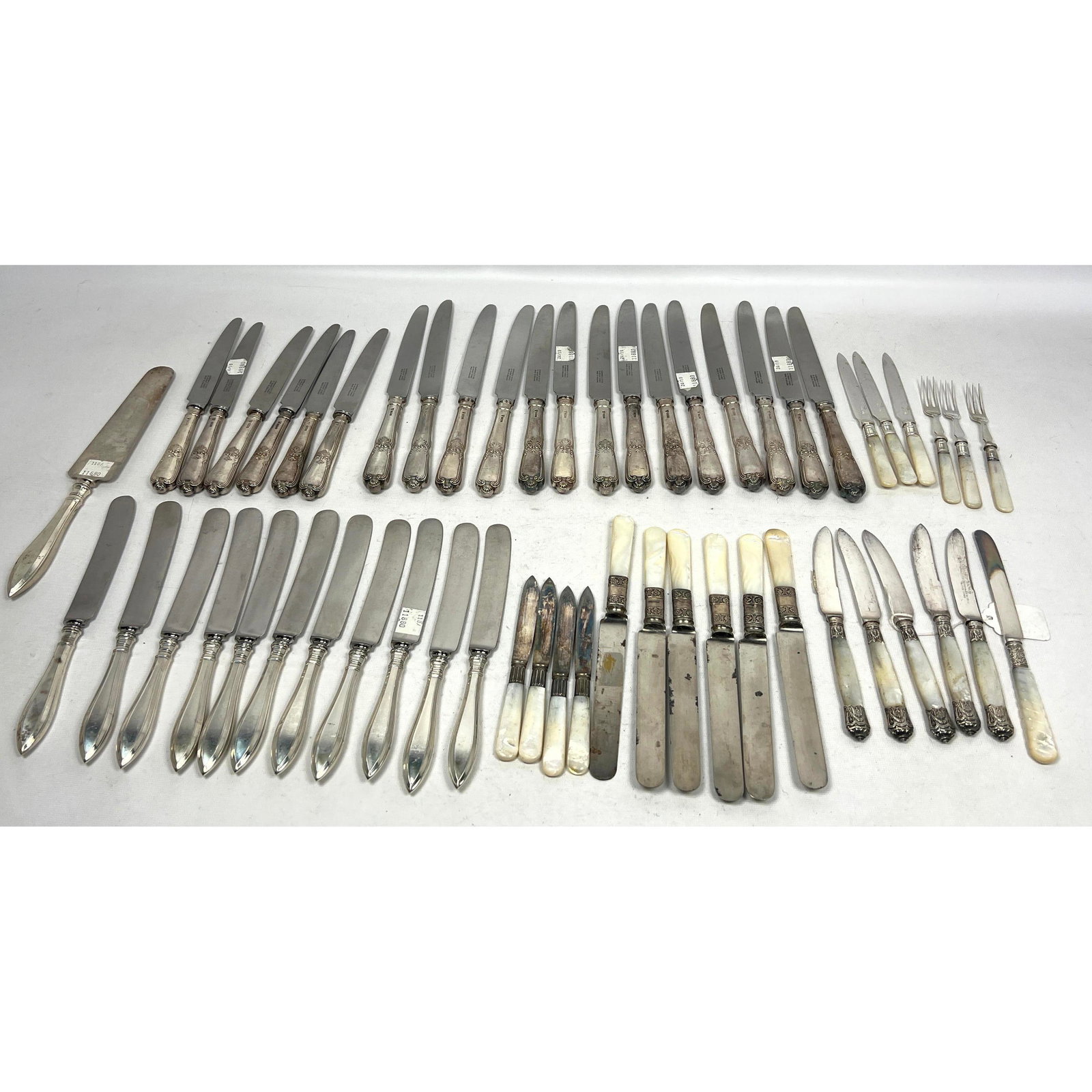 54pcs Flatware Knives. Sterling handled and Bands. Some Tiffany, Garrard, etc: 54pcs Flatware Knives. Sterling handled and Bands. Some Tiffany, Garrard, etc Dimensions: Height: 10 inches, Width: 1.5 inches, Depth: .5 inches. --- US Packing and Shipping charge: $35 Plus insurance