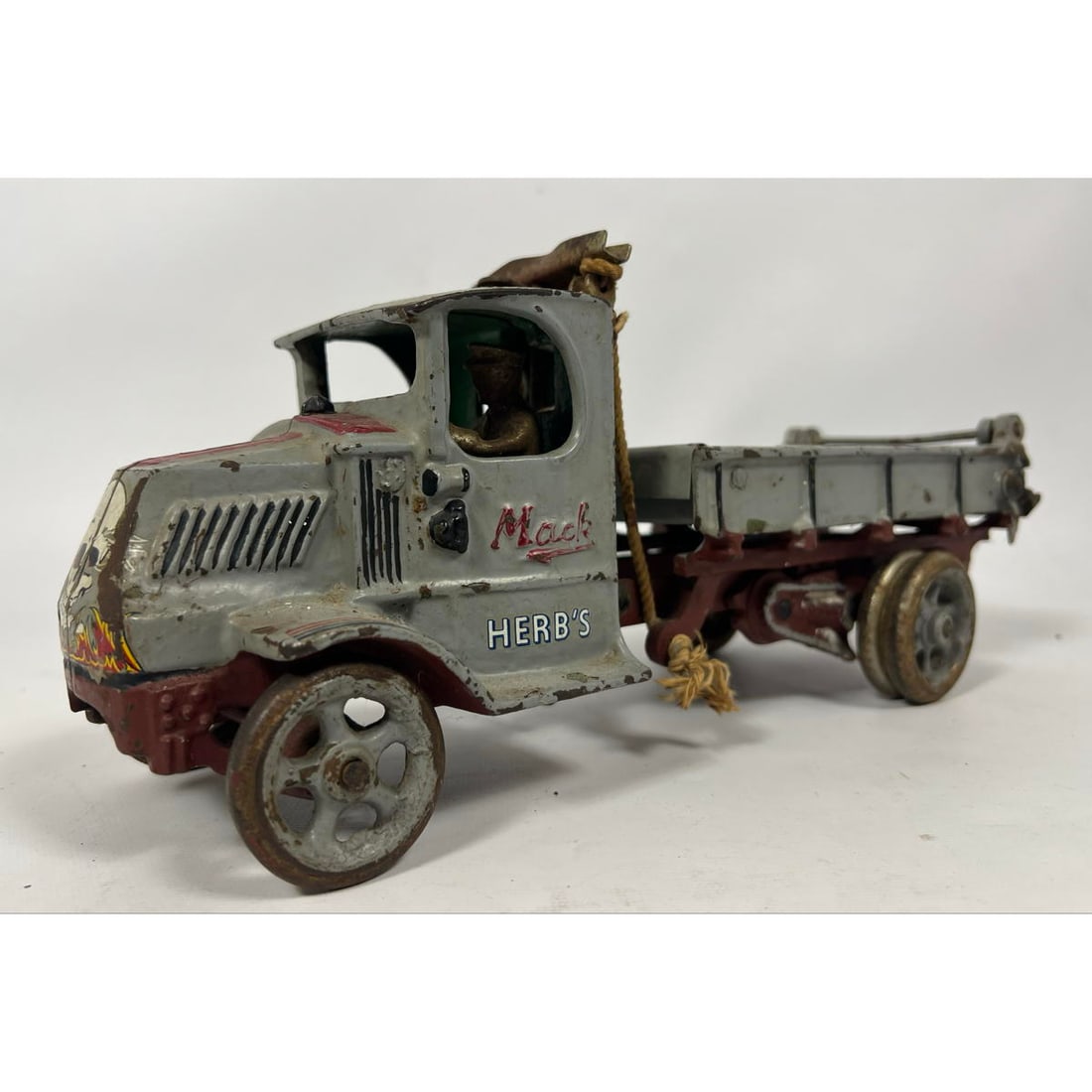 ARCADE MFG "Herb's MACK Dump Truck. Cast Iron Model Car Truck with original driver. Painted skull an (1 of 12)