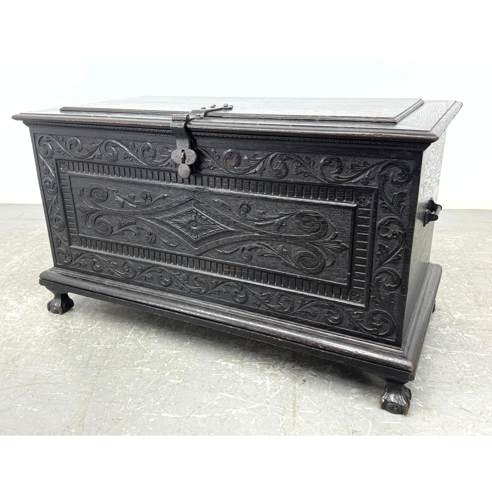 Antique Carved Oak Lidded Trunk Chest. Dark stain. Relief carved foliate design. Heavy iron strap hi (1 of 12)