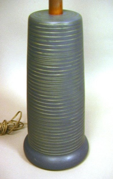 MARTZ Pottery Table Lamp with Teak Mounts. Incise: MARTZ Pottery Table Lamp with Teak Mounts. Incised ribbed design. Signed Martz.-- Dimensions: H: 32 inches: W: 8 inches ---