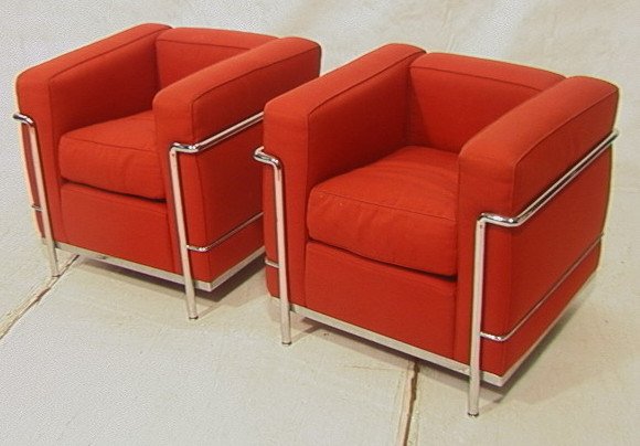 Pr CASSINA Chrome Chairs. Le Corbusier LC2 Model.: Pr CASSINA Chrome Chairs. Le Corbusier LC2 Model. Milano, Italy. Brick color cotton upholstered cushions. Both chairs have original retail tags.-- Dimensions: H: 27 inches: W: 30 inches: D: 28 inches