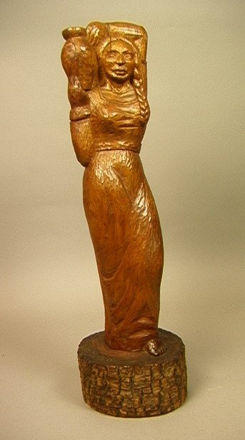 R. Du SELVA Carved Wood Figural Sculpture. Mexico: R. Du SELVA Carved Wood Figural Sculpture. Mexico. Woman with Braided Hair carries Jug. Inscribed "To Sam, Pedro Miguel, Oct 27, 1943, From Smitty". Signed on top of base. -- Dimensions: H: 21 inches: