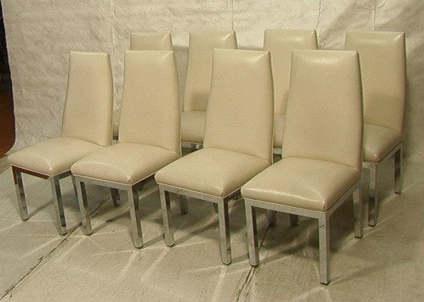 Set 8 TRIMARK DESIGNS Dining Chairs. MILO BAUGHMA: Set 8 TRIMARK DESIGNS Dining Chairs. MILO BAUGHMAN style. Thick chrome bases. Solid construction. White leather upholstery. Marked.-- Dimensions: H: 42 inches: W: 20 inches: D: 24 inches ---