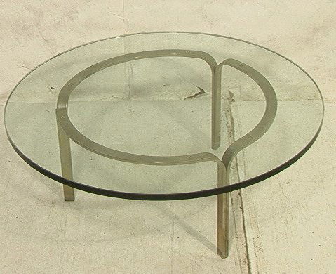 NICOS ZOGRAPHOS 70's Modern Glass Steel Tripod Co: NICOS ZOGRAPHOS 70's Modern Glass Steel Tripod Cocktail Coffee Table. Round 3/4" glass top on three legged stainless steel base. -- Dimensions: H: 14 inches: W: 36 inches ---