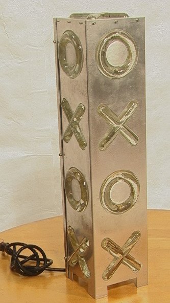 Glass & Aluminum Hugs & Kisses Table Lamp. Square: Glass & Aluminum Hugs & Kisses Table Lamp. Square constructed aluminum column with inset glass "X"s & "O"s. Made in Canada. Apkarian Machining.-- Dimensions: H: 24 inches: W: 6 inches: D: 6 inches ---