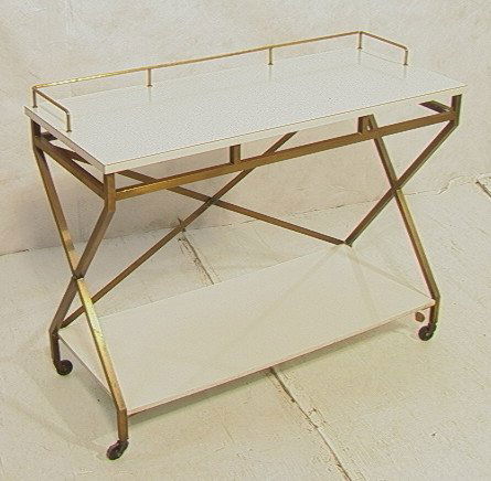 PAUL McCOBB style Bar Cart Server. Thin square fr: PAUL McCOBB style Bar Cart Server. Thin square frame and "X" sides. White Formica top & lower shelf. Brass gallery trim. On casters.-- Dimensions: H: 30.25 inches: W: 42 inches: D: 18 inches ---