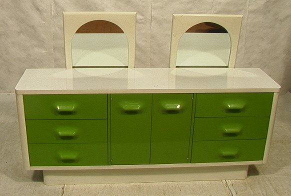 BROYHILL PREMIER Low Dresser. Raymond Loewy style: BROYHILL PREMIER Low Dresser. Raymond Loewy style. Two mirrors. Green plastic molded fronts in white Lacquer cabinet dresser. White Laminate top. Six drawers and two doors.-- Dimensions: H: 30 inches: