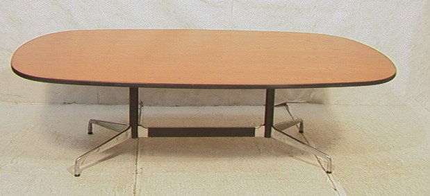 Large HERMAN MILLER Conference Dining Table. Blac: Large HERMAN MILLER Conference Dining Table. Black & Aluminum Base. Rubber Edges to Oval Table Top.-- Dimensions: H: 28 inches: D: 54 inches: L: 93 inches ---