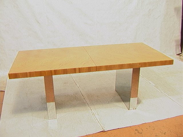 MILO BAUGHMAN style Dining Table. Book Matched ve: MILO BAUGHMAN style Dining Table. Book Matched veneer top on chrome base. (2) 22" leaves. Probably by Directional.-- Dimensions: H: 28 inches: D: 40 inches: L: 78 inches ---
