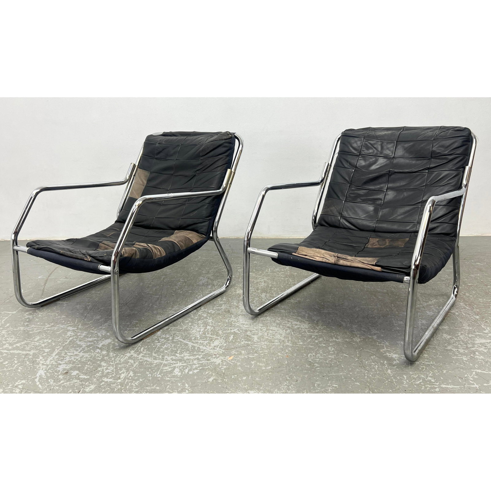 Pair Tubular Chrome and Leather Patchwork Sling Lounge Chair, possibly Ikea: Pair Tubular Chrome and Leather Patchwork Sling Lounge Chair, possibly Ikea Dimensions: Height: 28.5 inches, Width: 25 inches, Depth: 32 inches. - Seat Height: 14 inches --- - - We offer curbside deli