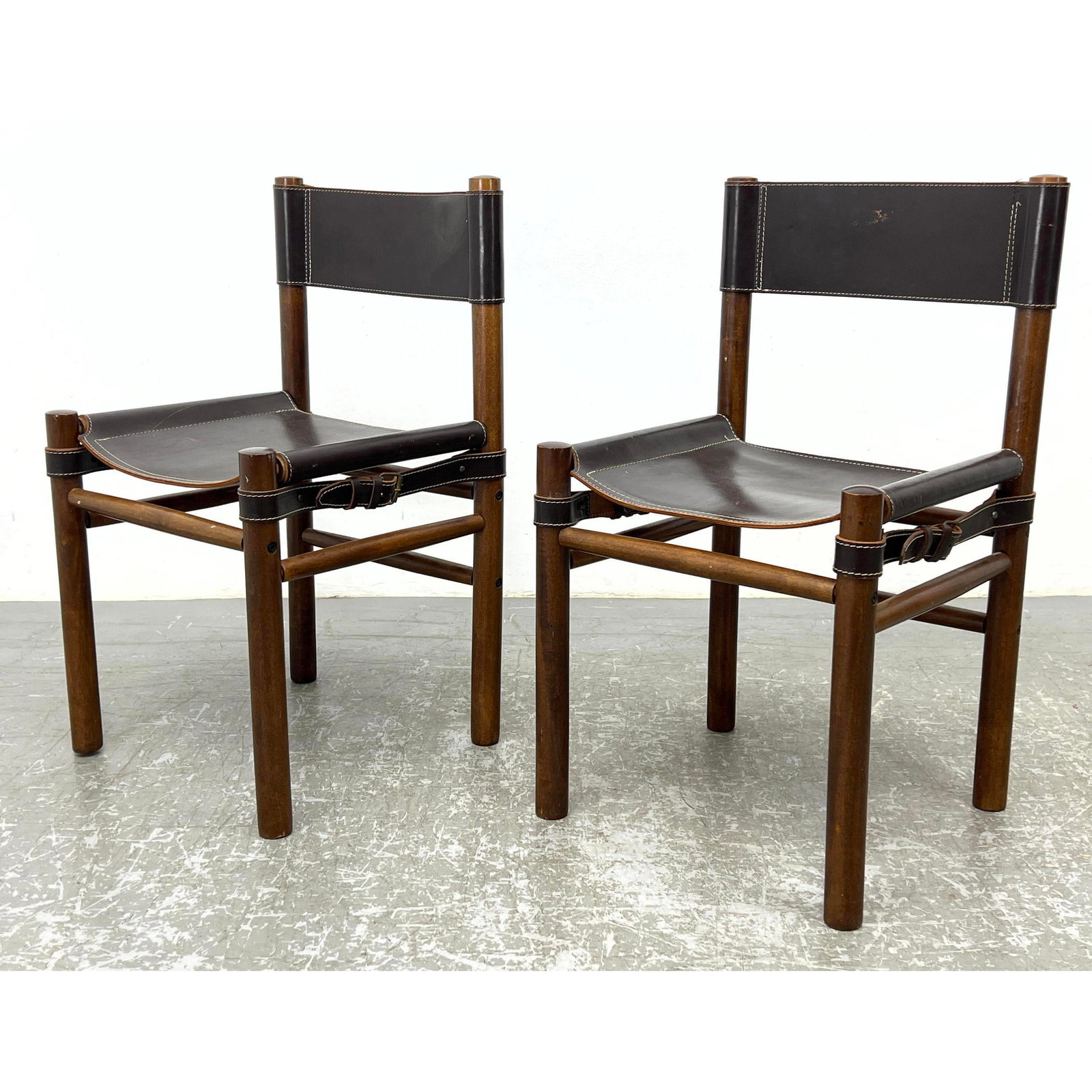 Pr Leather sling chairs. Campaign Safari Style. Made in Argentina: Pr Leather sling chairs. Campaign Safari Style. Made in Argentina Dimensions: Height: 32 inches, Width: 17.5 inches, Depth: 17 inches. - Seat Height: 17 inches --- - - We offer curbside delivery to NY