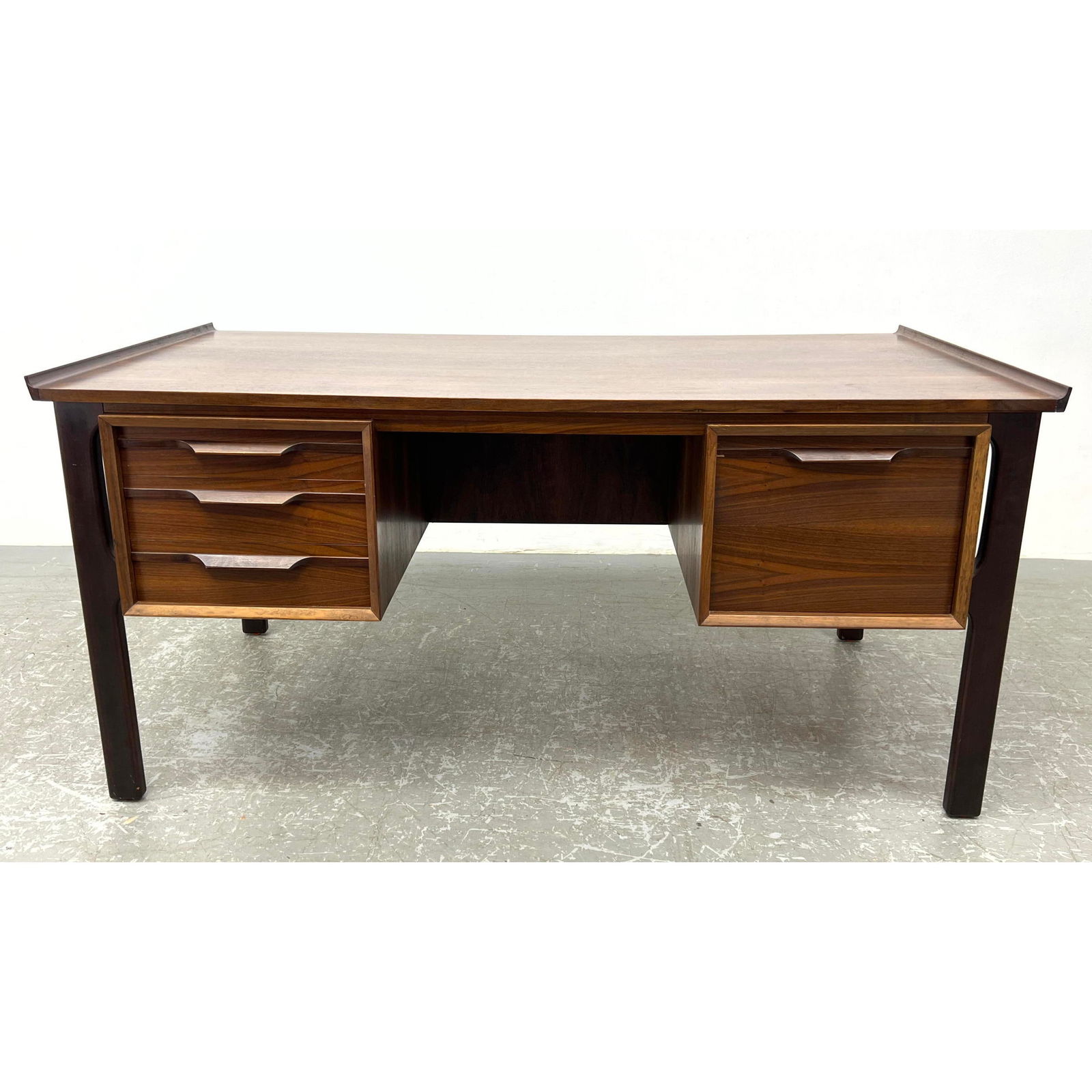 Good Danish Modern executive desk. Raised rim top.  Back side has compartments. (1 of 12)