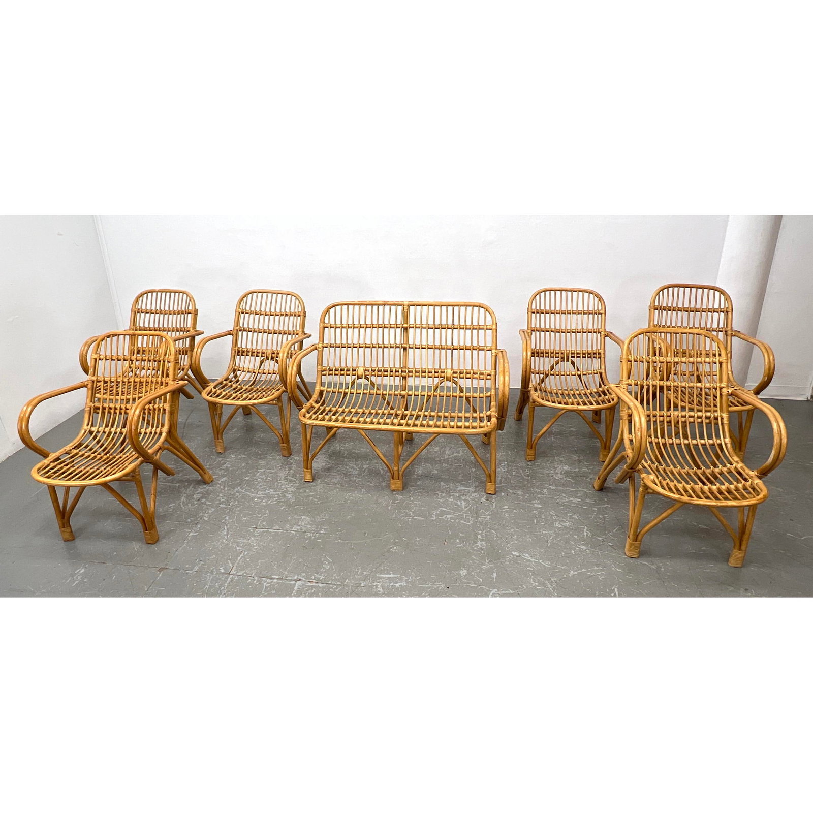 7pcs Rattan Bamboo Seating. Love seat and 6 Arm Chairs. Loose cushions.: 7pcs Rattan Bamboo Seating. Love seat and 6 Arm Chairs. Loose cushions. Dimensions: Height: 35 inches, Width: 44.25 inches, Depth: 26.5 inches. - Seat Height: 17.5 inches - Additional Dimensions: Chai