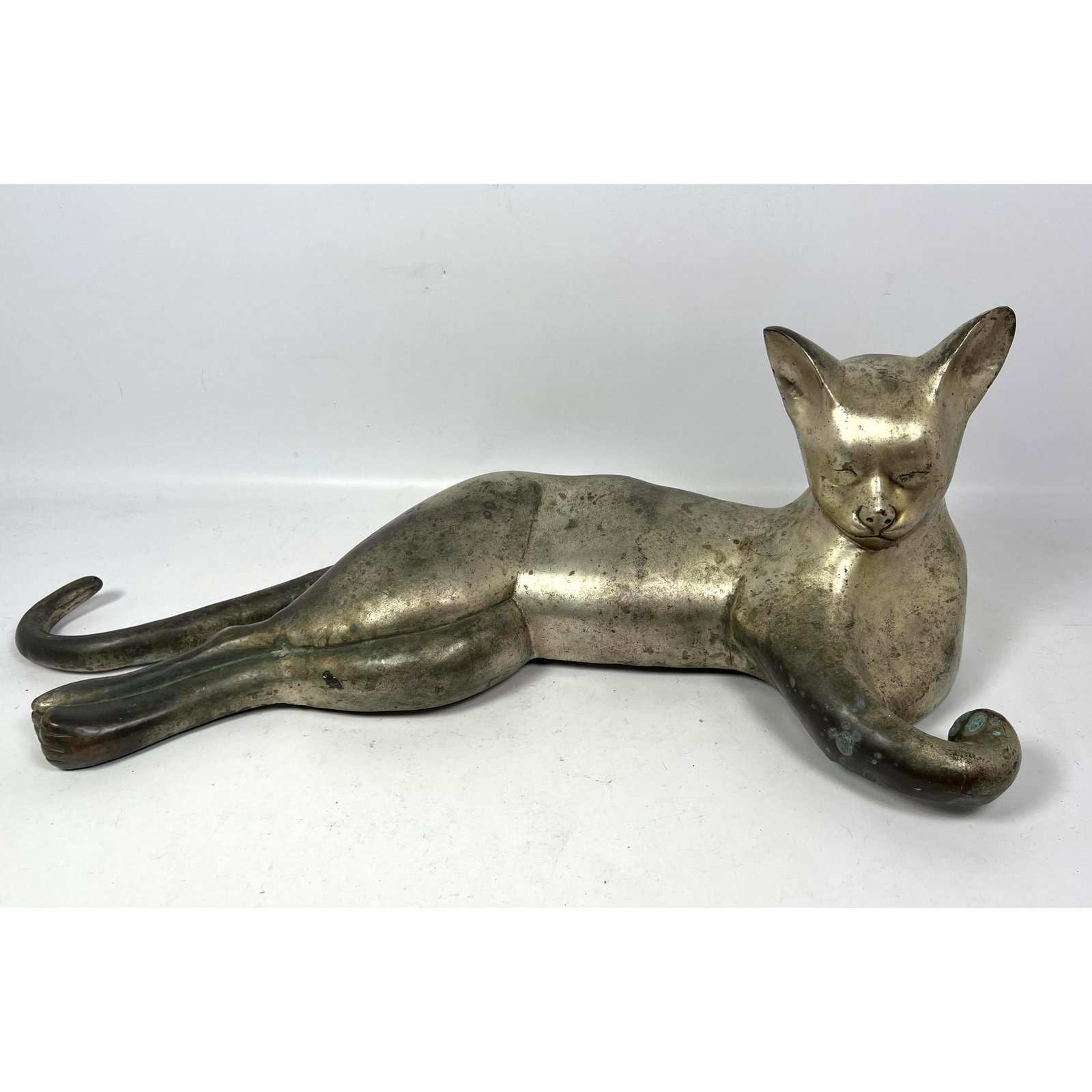Oversized, metal reclining cat sculpture. Hollow metal construction. (1 of 8)