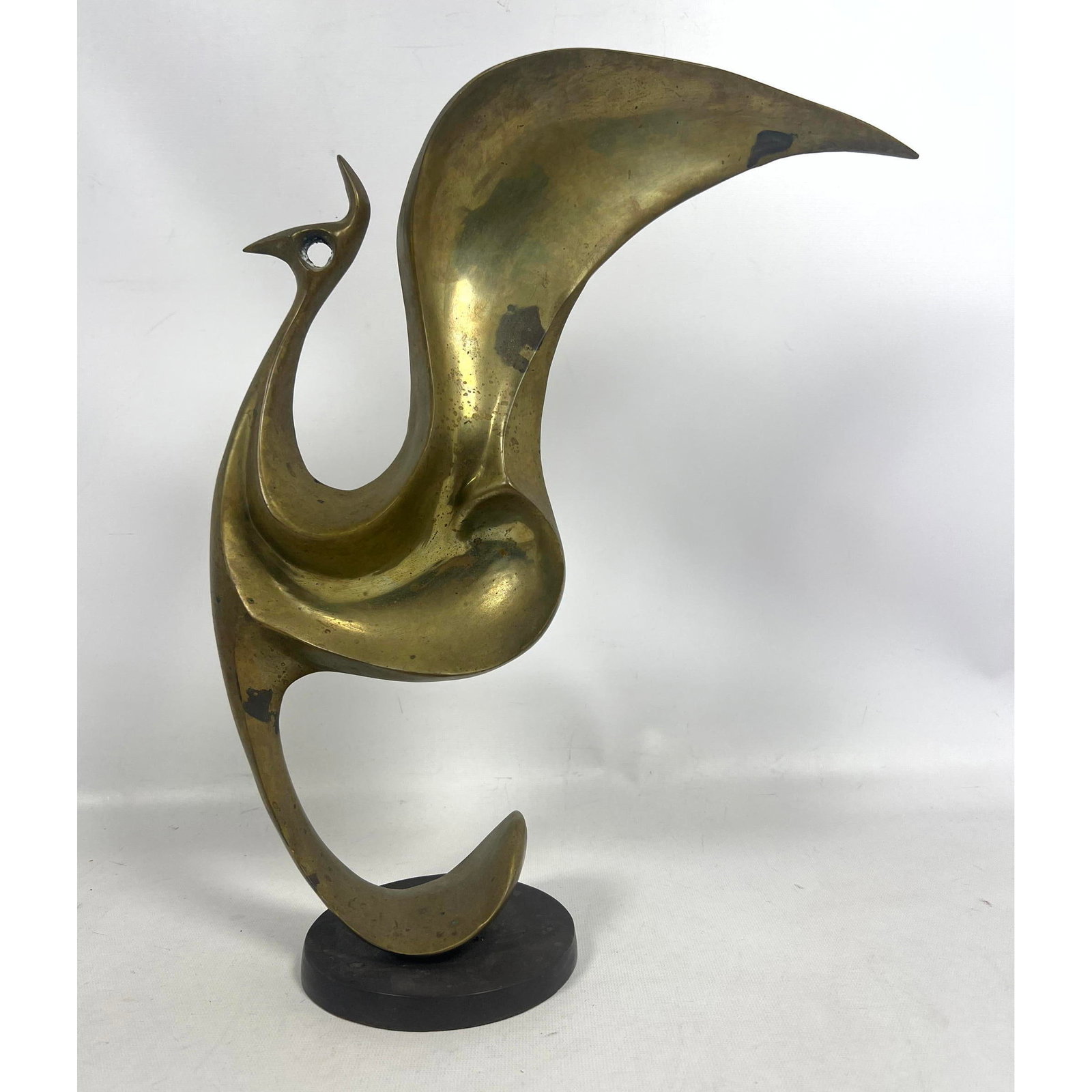 Stylized Brass Bird Modernist Sculpture. Black Base. Not marked.: Stylized Brass Bird Modernist Sculpture. Black Base. Not marked. Dimensions: Height: 15 inches, Width: 13.5 inches, Depth: 5 inches. --- US Packing and Shipping charge: In house shipping available. Wi