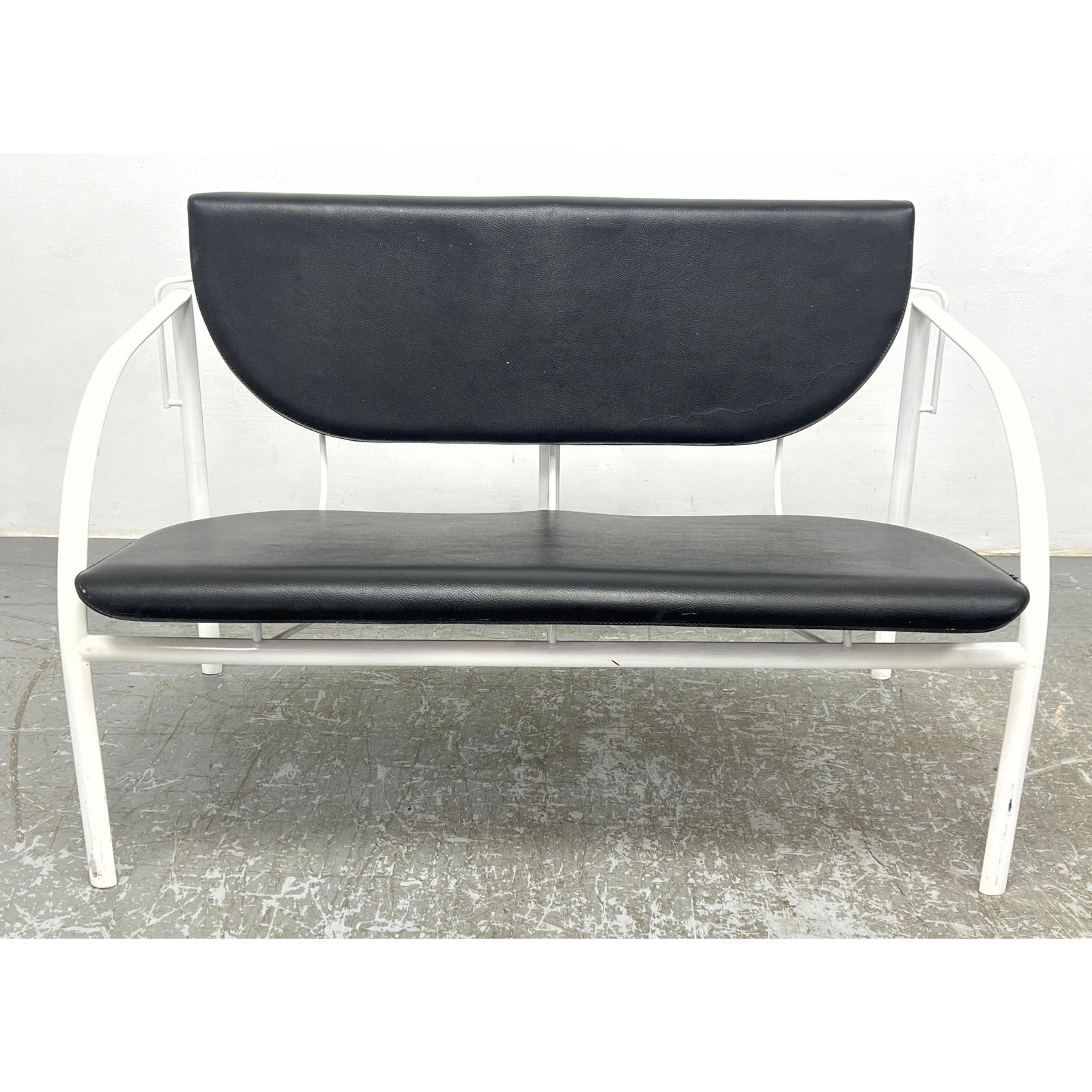 STENDIG Mid Century Modern Love Seat. White enameled Metal Frame with pebble textured leather Seat a (1 of 11)