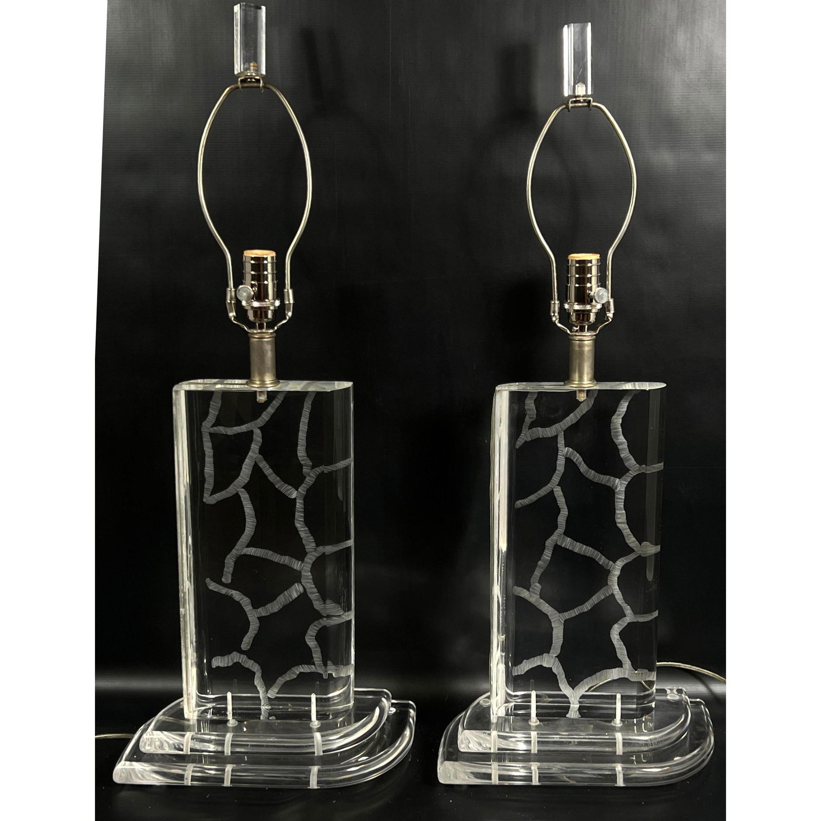 Pair Van Teal Mid Century Modern Lucite Acrylic Table Lamps. Incised design.: Pair Van Teal Mid Century Modern Lucite Acrylic Table Lamps. Incised design. Dimensions: Height: 30.5 inches, Width: 12.5 inches, Depth: 7 inches. --- - - We offer curbside delivery for most items to